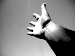 Reaching_hand She was looking for someone who'd injured their hand recently. A woman stood up.