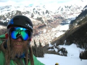 Telluride,_CO(5) Jaimé Palmer with the town of Telluride, Colorado below him