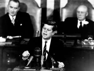 John F. Kennedy declaring that we would put a man on the moon by the end of the decade