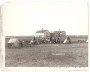 Teepees before an Indian boarding school.