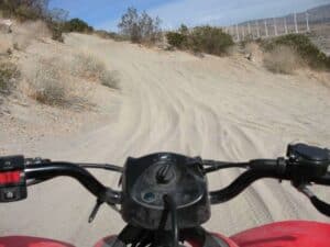 Driving an ATV in the sand dunes near Palm Springs.