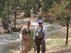 Malcolm David Logan and Tim Lincoln fly fishing in Colorado.