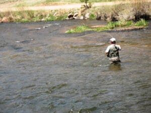 Fly fishing in the waters of the North Platte River near Deckers, Colorado.