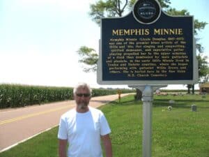 Malcolm Logan at the Memphis Minnie Blues Marker sign near her grave.