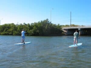 Malcolm Logan and Tim Lincoln paddleboarding in Key West