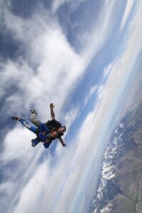 Cambelle Logan skydiving over the Wasatch Mountains in Erda, Utah