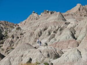 Hikers on Saddle Pass Trail in Badlands National Park