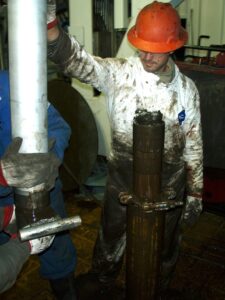 Oil field worker pulling Bakken core