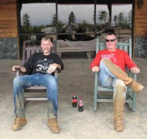 Malcolm Logan and Randy Gray sitting on the porch at Carolina Adventure World