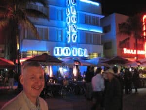 Malcolm Logan in front of the art deco hotels on Ocean Drive in Miami Beach