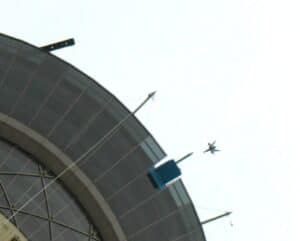 A figure jumps from the top of the Stratosphere Tower, as seen from the ground