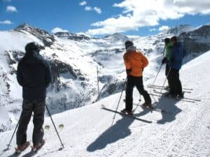Four skiers getting ready to drop into the Black Iron Bowl at Telluride