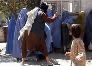 Taliban beating a woman in public. 